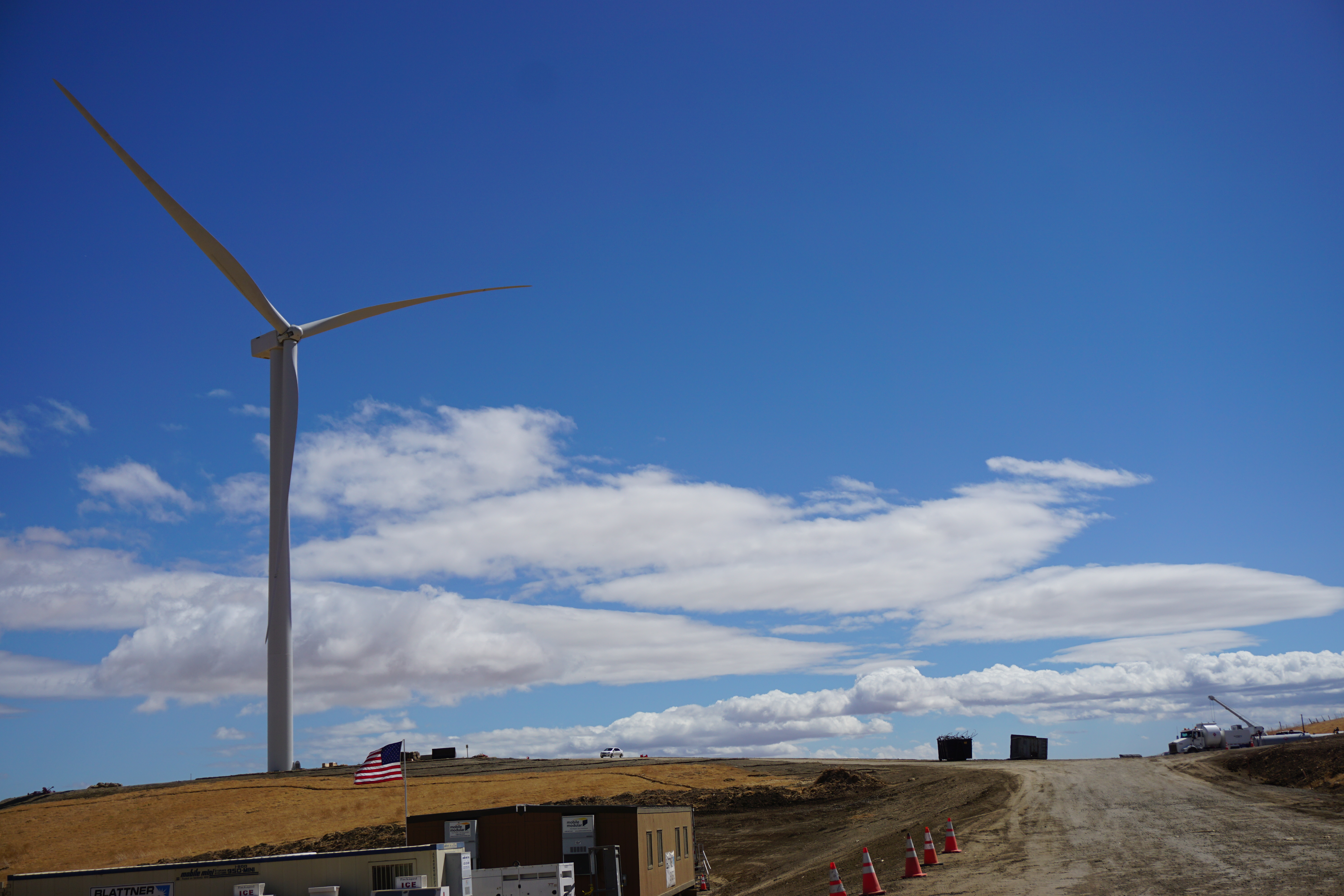 Wind turbine with blue sky in the background