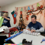 dk Engineering staff wrapping Christmas presents