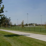 Sports complex with bleachers and lights