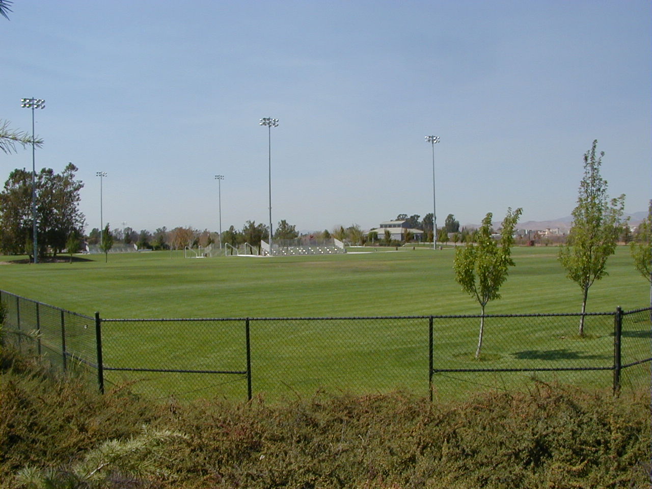 Sports complex with bleachers and lights